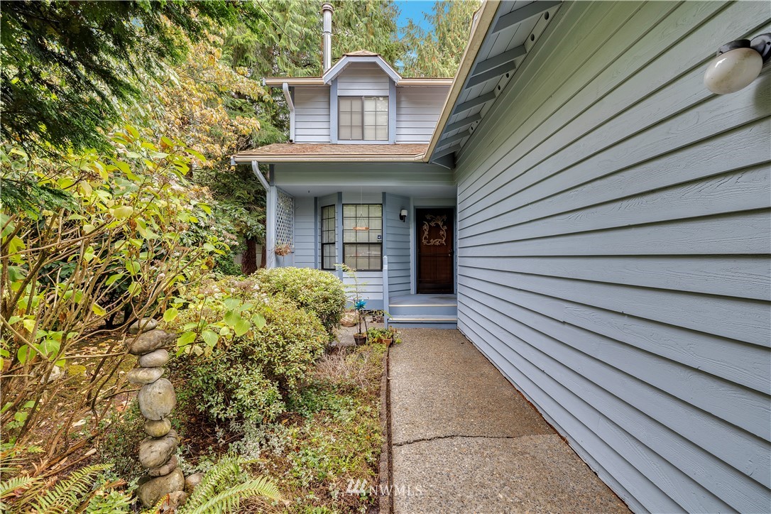 25419 213th Place Southeast, Unit 60 Maple Valley, WA 98038 - Photo 4 of 27 a view of a house with a small yard