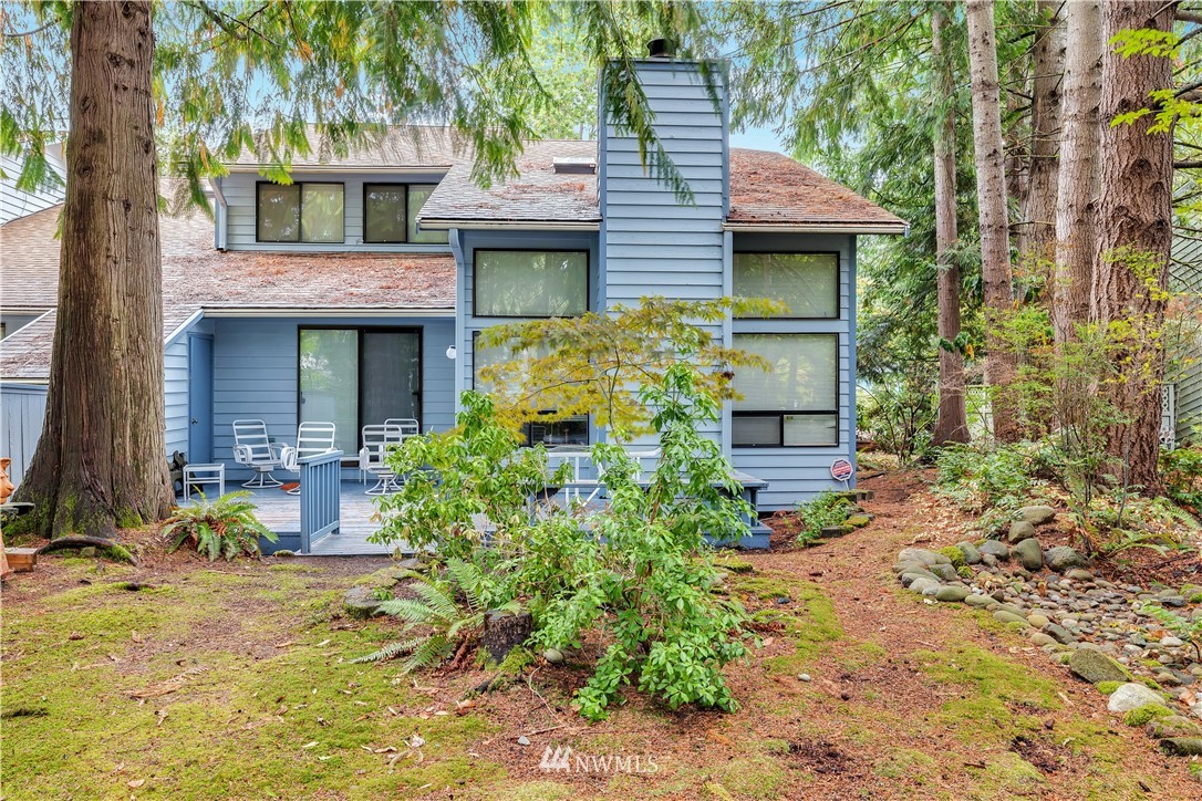 25419 213th Place Southeast, Unit 60 Maple Valley, WA 98038 - Photo 6 of 27 a front view of a house with a yard