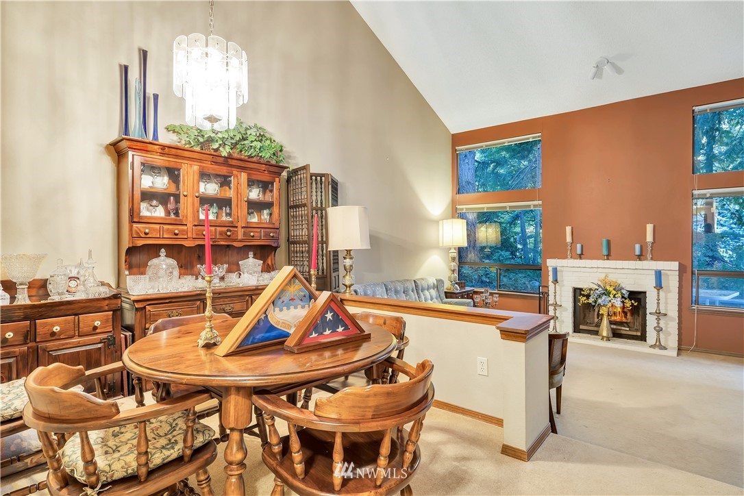 25419 213th Place Southeast, Unit 60 Maple Valley, WA 98038 - Photo 7 of 27 a patio with a table and chairs