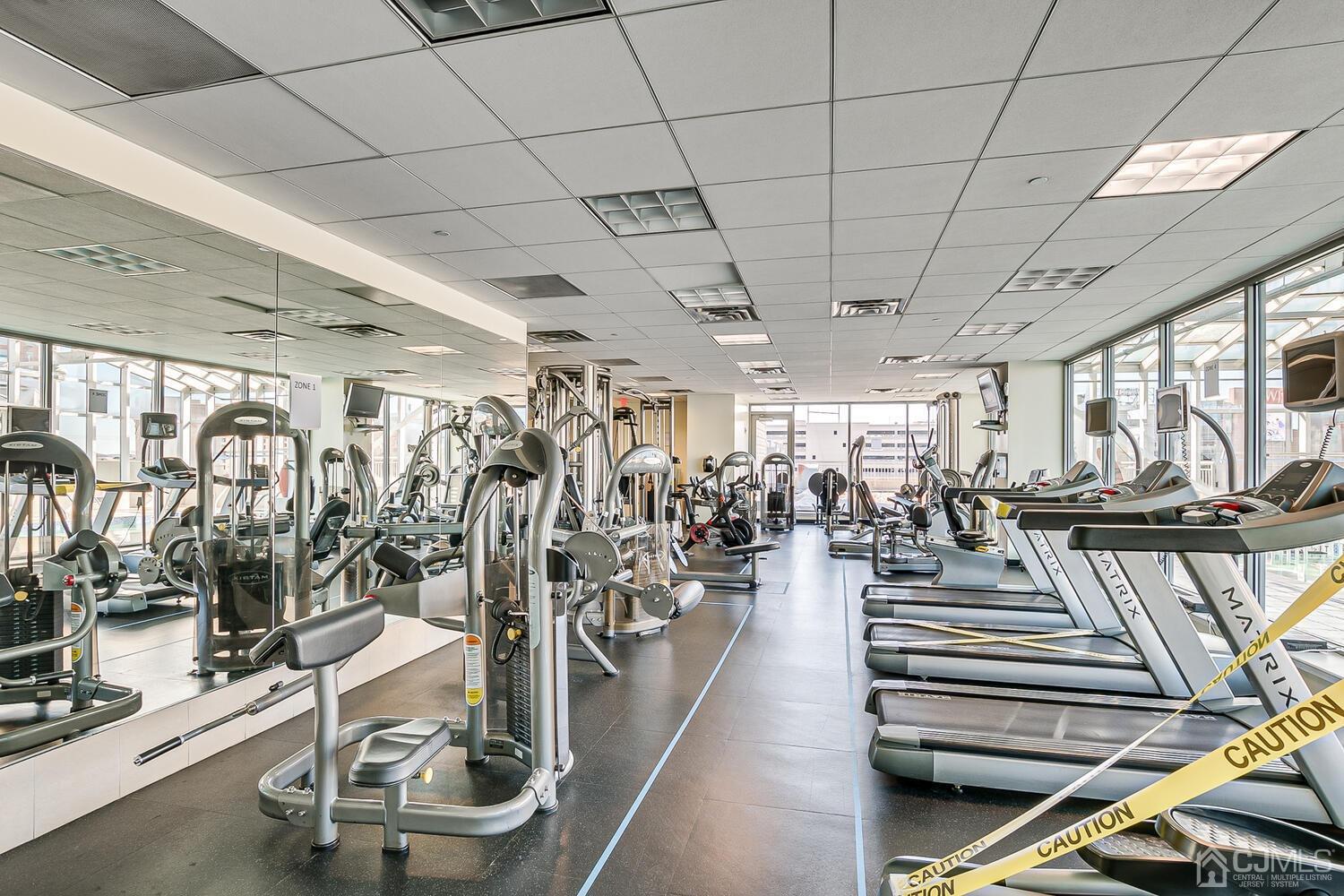 1 Spring Street, Unit 1806 New Brunswick, NJ 08901 - Photo 36 of 57 a view of a room with gym equipment