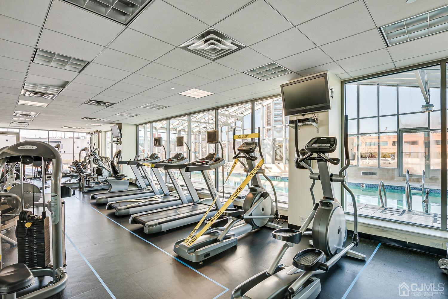 1 Spring Street, Unit 1806 New Brunswick, NJ 08901 - Photo 37 of 57 a view of a room with gym equipment