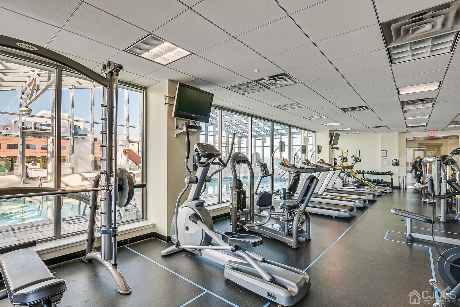 1 Spring Street, Unit 1806 New Brunswick, NJ 08901 - Photo 38 of 57 a view of a room with gym equipment