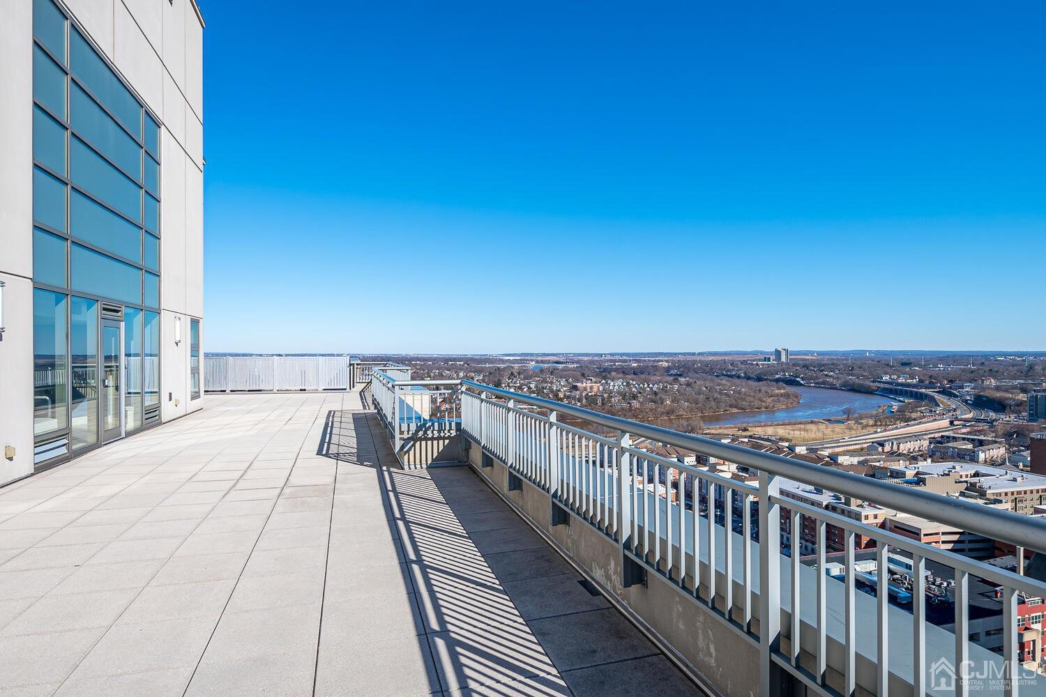 1 Spring Street, Unit 1806 New Brunswick, NJ 08901 - Photo 50 of 57 a view of a balcony with city