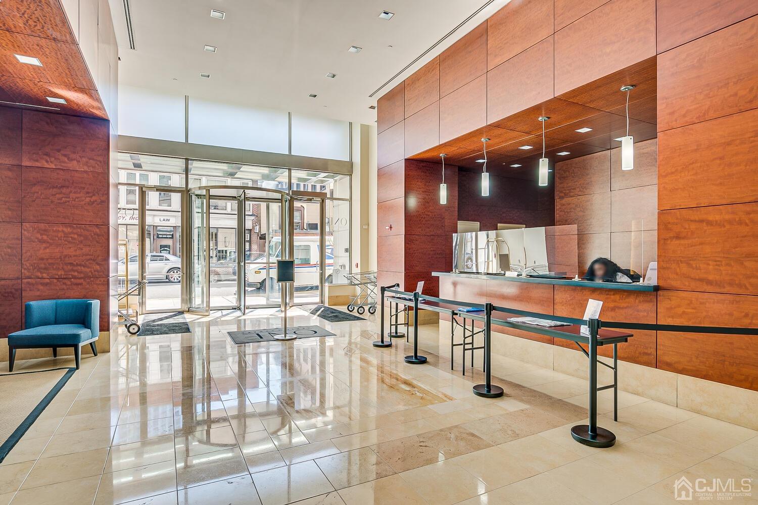1 Spring Street, Unit 1806 New Brunswick, NJ 08901 - Photo 8 of 57 a lobby with furniture and window