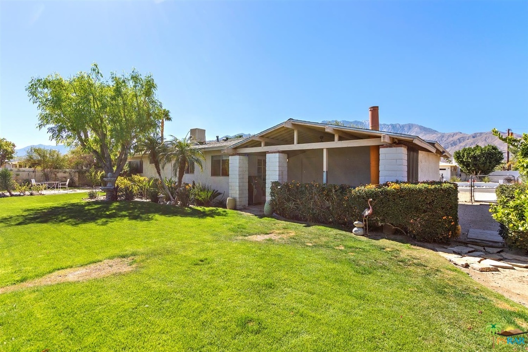 2802 North Chuperosa Road Palm Springs, CA 92262 - Photo 19 of 25 a front view of a house with a yard