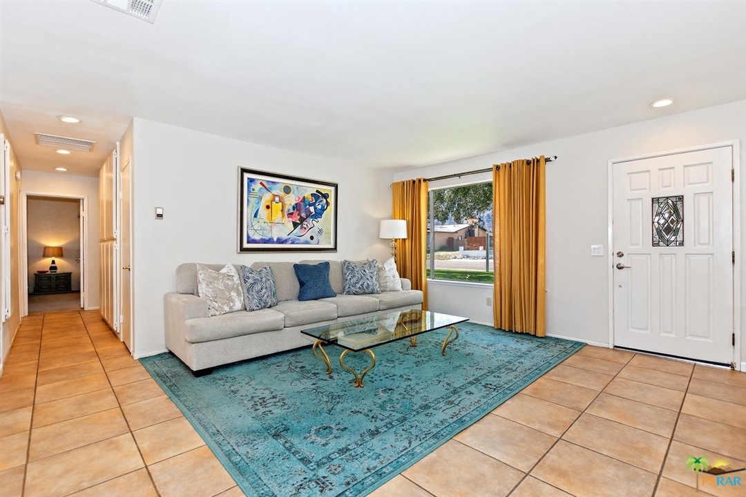 2802 North Chuperosa Road Palm Springs, CA 92262 - Photo 2 of 25 a living room with furniture and a rug