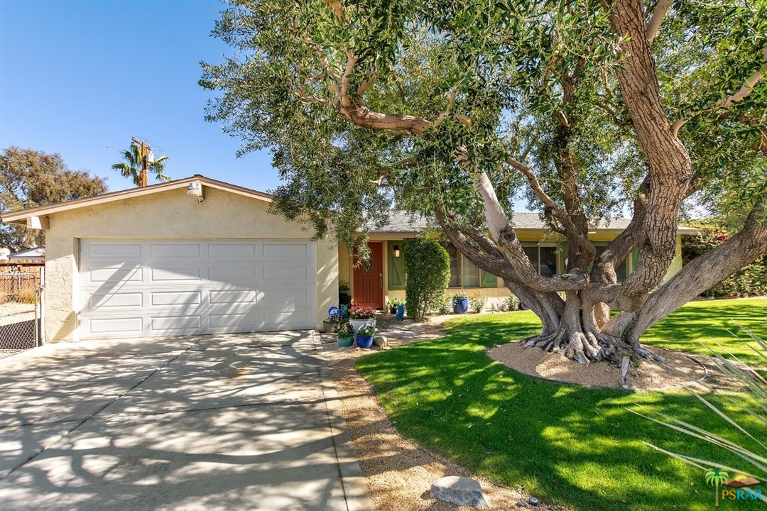 2802 North Chuperosa Road Palm Springs, CA 92262 - Photo 22 of 25 a front view of a house with a yard and garage