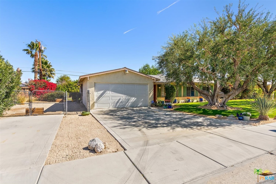 2802 North Chuperosa Road Palm Springs, CA 92262 - Photo 23 of 25 a front view of a house with a yard and garage