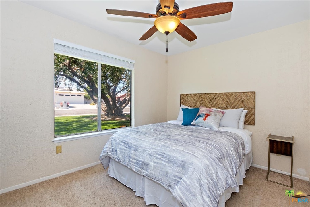 2802 North Chuperosa Road Palm Springs, CA 92262 - Photo 10 of 25 a bedroom with a bed and a window