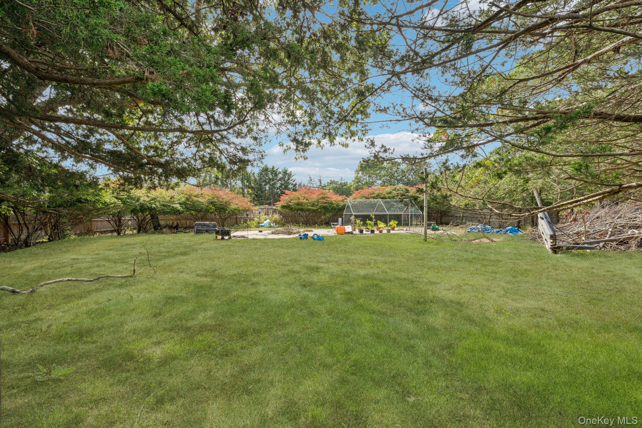 12 Laila Lane Remsenburg, NY 11960 - Photo 40 of 50 a view of grassy field with benches