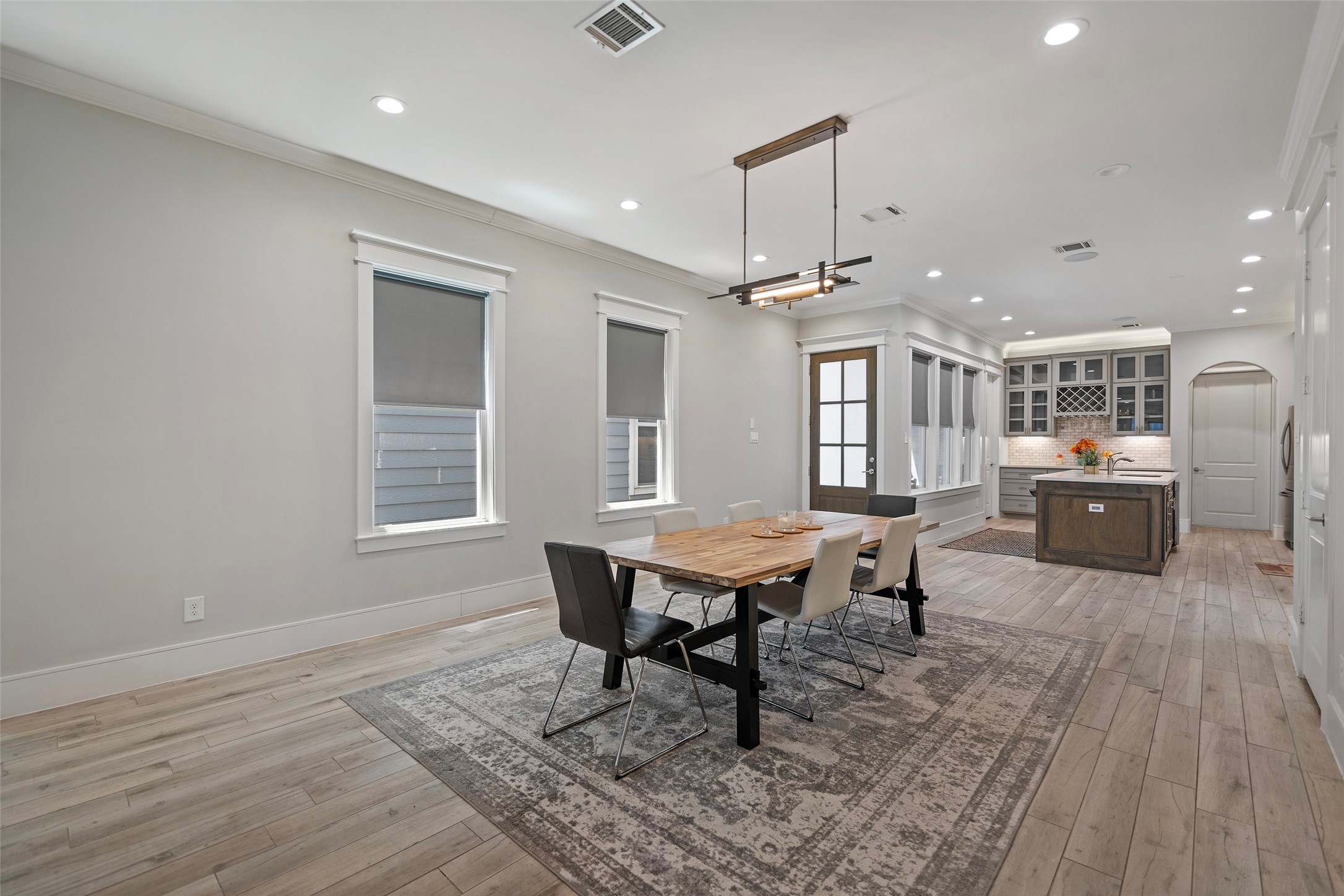 6533 Castlebay Drive Houston, TX 77092 - Photo 12 of 50 a living room with dining room and wooden floor
