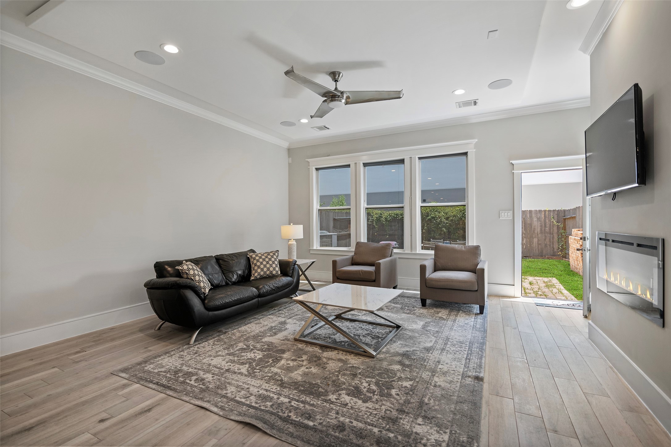 6533 Castlebay Drive Houston, TX 77092 - Photo 17 of 50 a living room with fireplace furniture and a flat screen tv