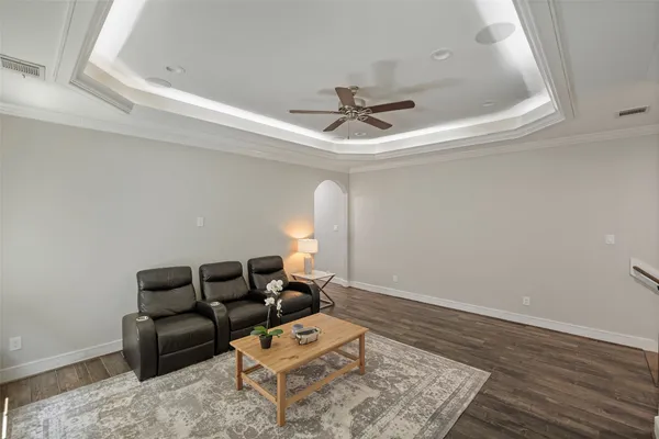 a living room with furniture and a rug