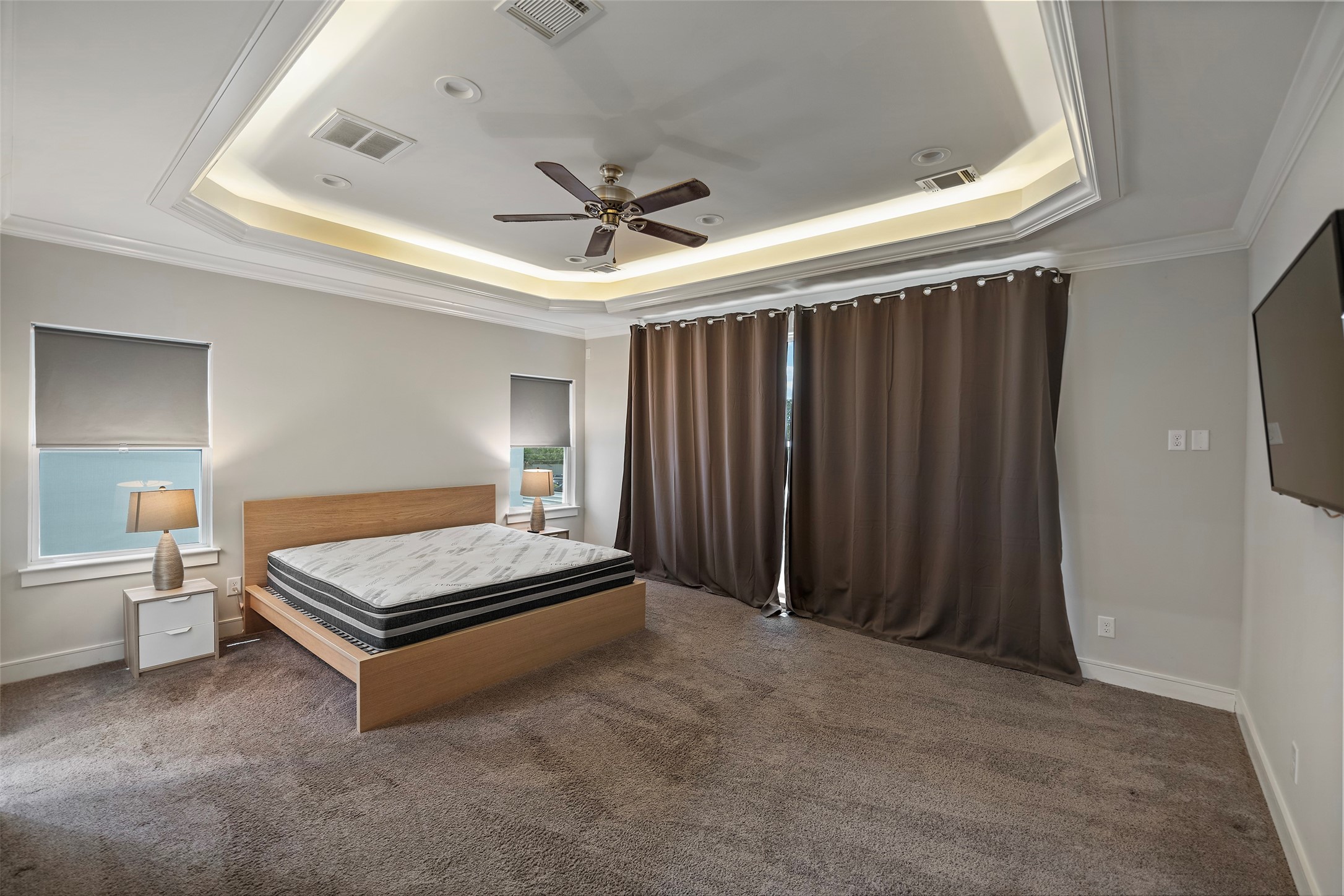 6533 Castlebay Drive Houston, TX 77092 - Photo 24 of 50 a bedroom with a bed and a chandelier