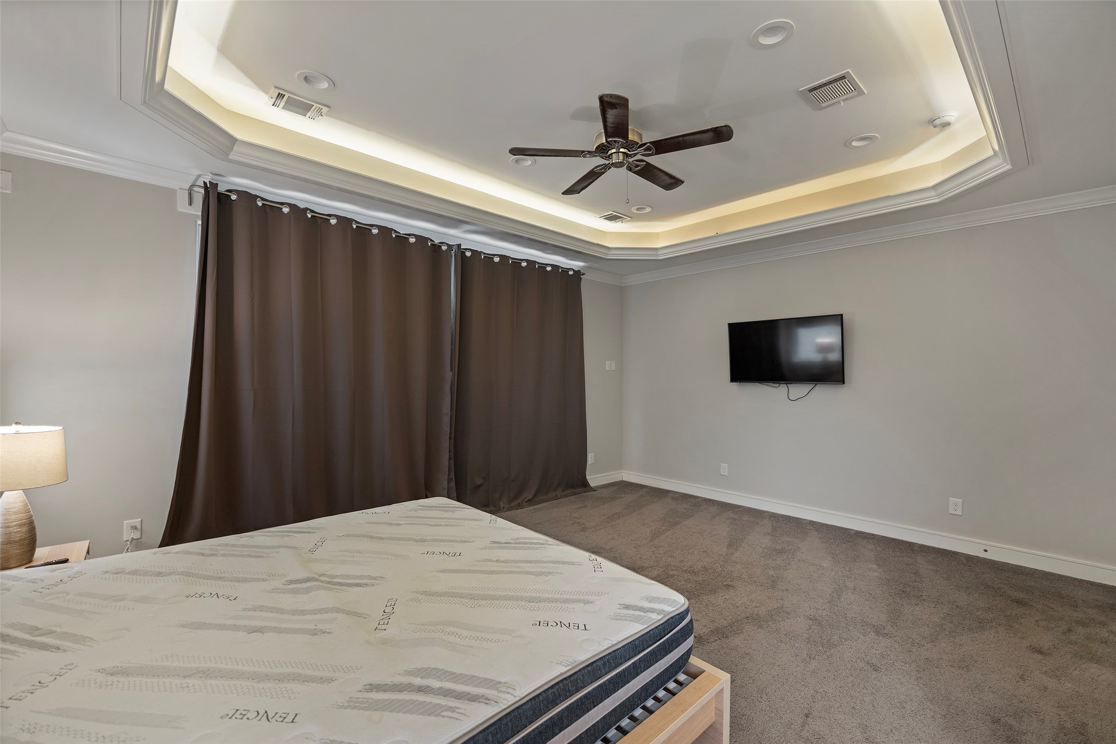 6533 Castlebay Drive Houston, TX 77092 - Photo 25 of 50 a bed room with a bed and a ceiling fan