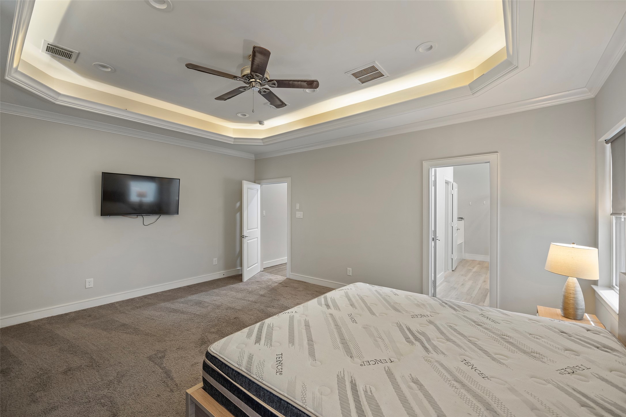 6533 Castlebay Drive Houston, TX 77092 - Photo 26 of 50 a bedroom with a bed and a flat screen tv