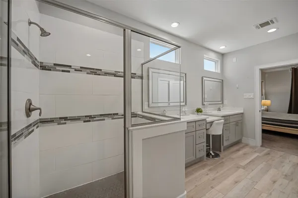 a view of bathroom with dual sinks