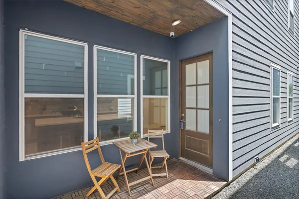 a view of a room that has a table and chairs