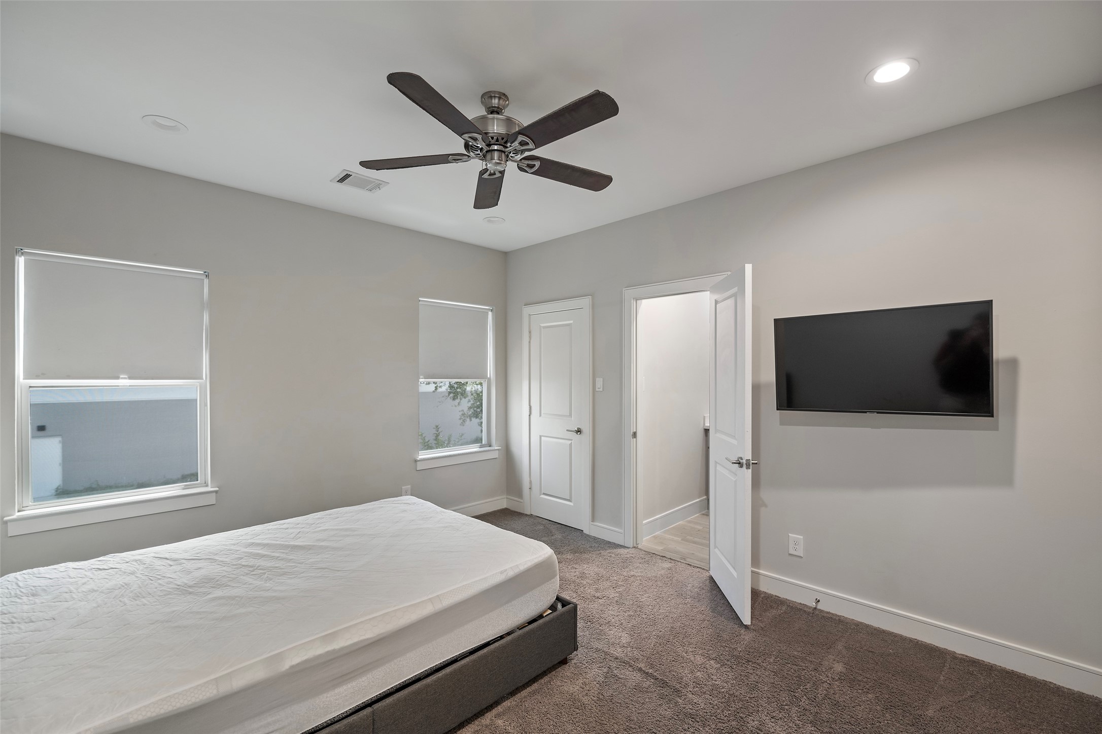 6533 Castlebay Drive Houston, TX 77092 - Photo 39 of 50 a bedroom with a bed and a flat screen tv