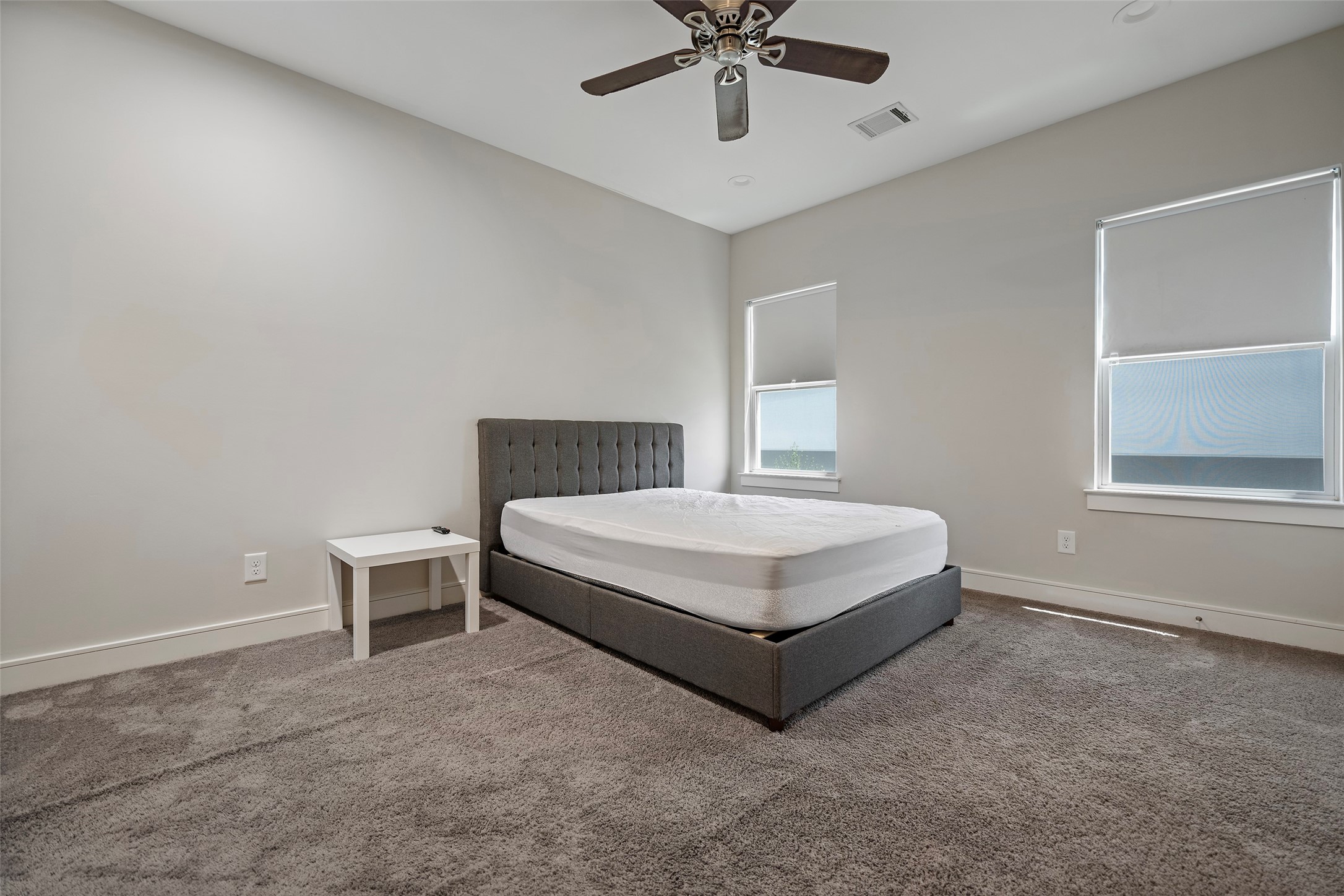 6533 Castlebay Drive Houston, TX 77092 - Photo 40 of 50 a bedroom with a bed and a chandelier