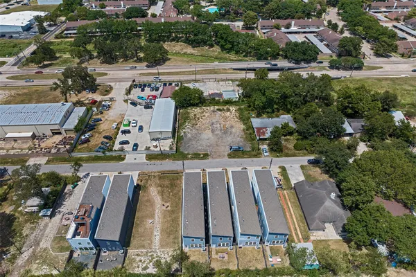 an aerial view of residential house with outdoor space and swimming pool