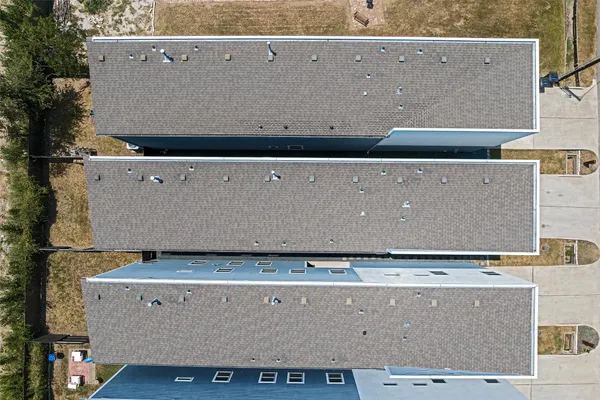 an aerial view of house with yard