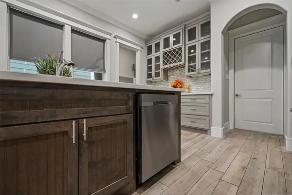 a kitchen with a refrigerator and sink