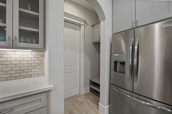 a kitchen with stainless steel appliances a refrigerator and a sink