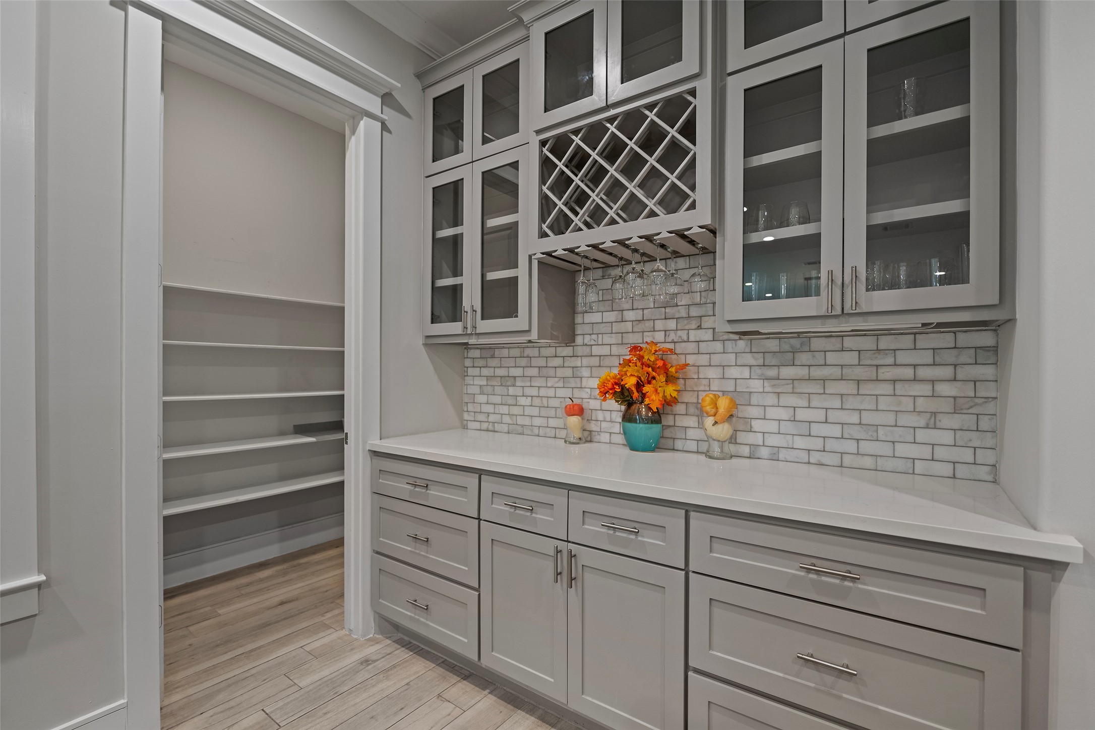 6533 Castlebay Drive Houston, TX 77092 - Photo 10 of 50 a kitchen with a cabinets and potted plant on the wooden shelf