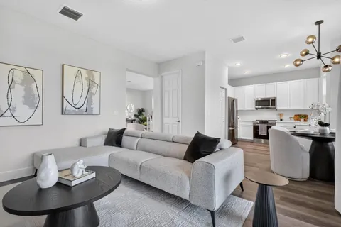 a view of a hallway view with wooden floor and staircase