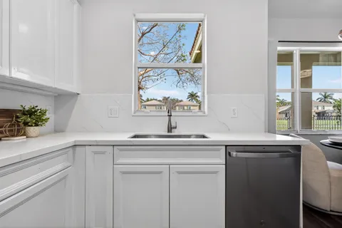 a bedroom with a bed and a lamp