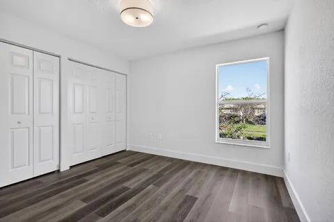 a bathroom with a glass shower door