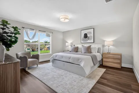 a view of an empty room and wooden floor
