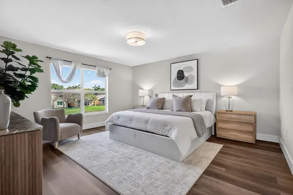 a view of an empty room and wooden floor