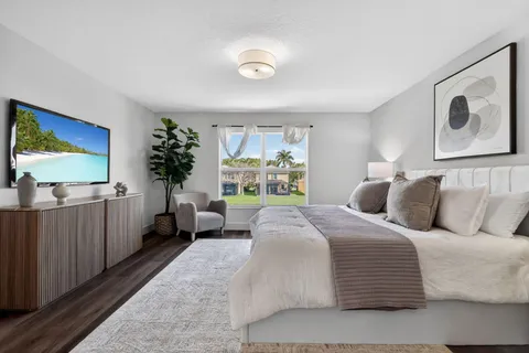 an aerial view of residential houses with outdoor space and street view