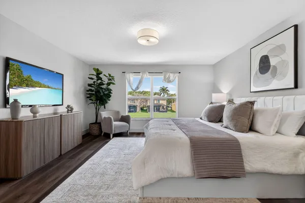 an aerial view of residential houses with outdoor space and street view