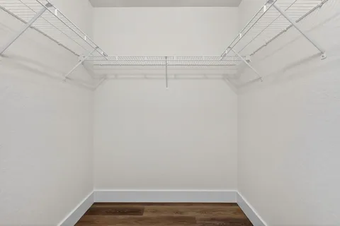 an aerial view of residential houses with outdoor space and street view