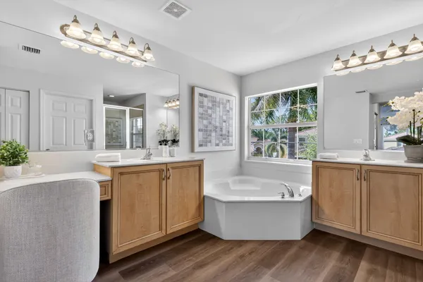 a view of a tennis ground with a small swimming pool