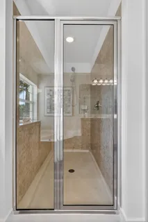 a view of a patio with couches table and chairs and potted plants