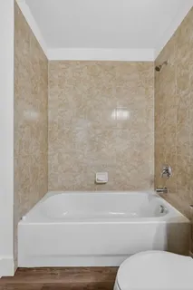 a view of house with swimming pool and a yard