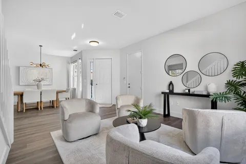 a view of a dining room with furniture window and wooden floor