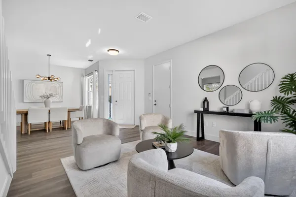 a view of a dining room with furniture window and wooden floor