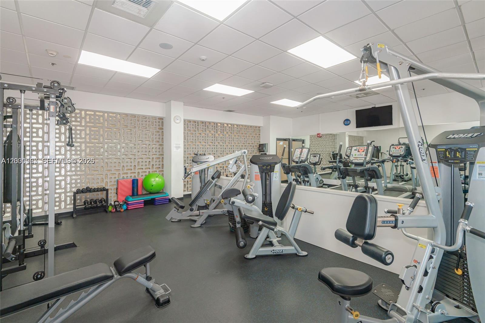 9511 Collins Avenue, Unit 811 Surfside, FL 33154 - Photo 25 of 29 a view of a room with gym equipment