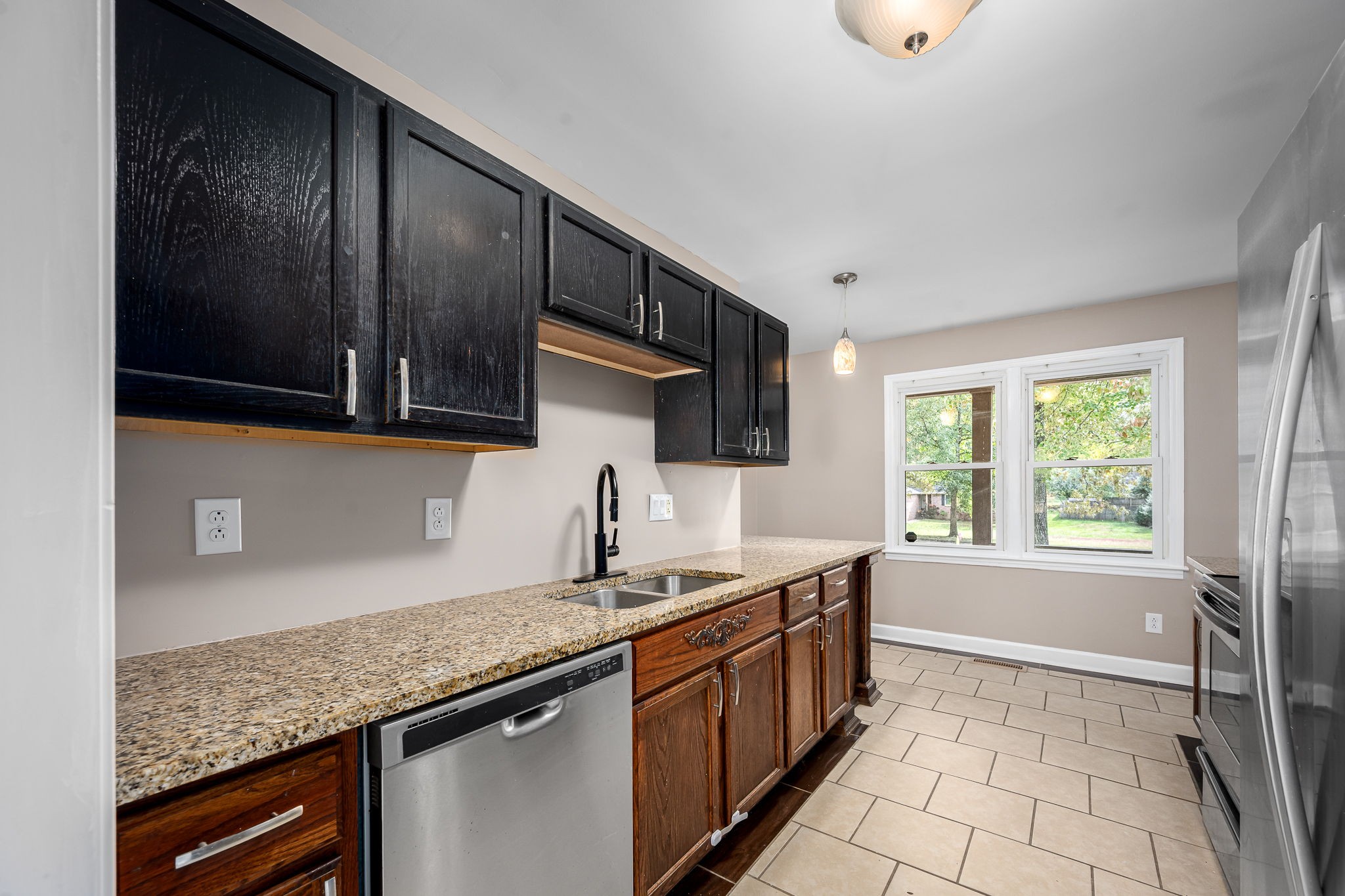 104 Dove Hollow Road Tullahoma, TN 37388 - Photo 13 of 37 a kitchen with granite countertop a sink and a stove