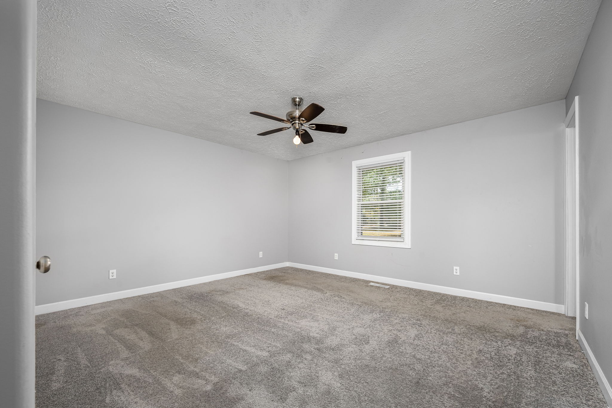 104 Dove Hollow Road Tullahoma, TN 37388 - Photo 20 of 37 a view of a livingroom with a ceiling fan and window