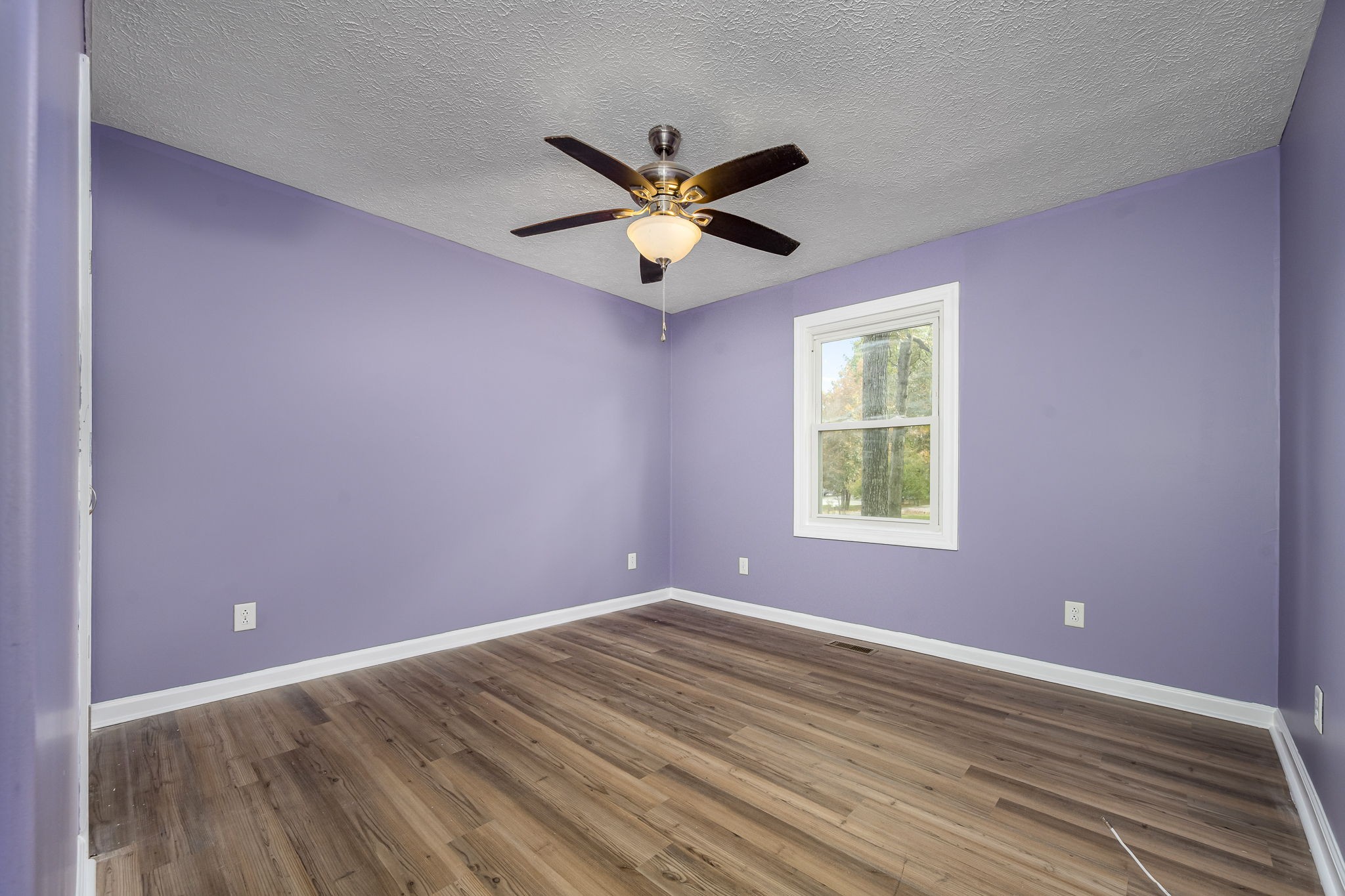 104 Dove Hollow Road Tullahoma, TN 37388 - Photo 24 of 37 a view of an empty room with window and a ceiling fan