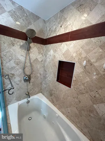 a view of an empty room and wooden floor