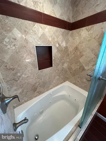 a kitchen with a sink appliances and cabinets