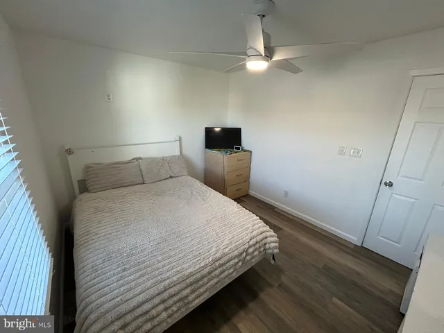 a kitchen with stainless steel appliances kitchen island granite countertop a sink stove and refrigerator