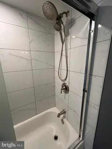 a view of a balcony with wooden floor and fence